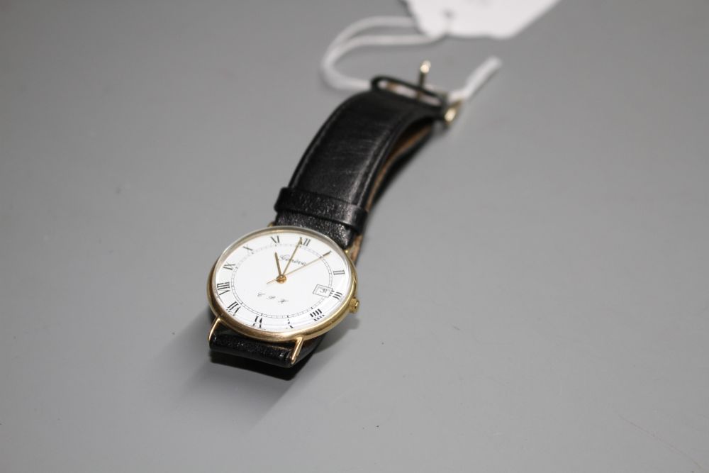 A gentlemans 9ct gold quartz? dress wrist watch, with Roman dial and date aperture, on associated leather strap.